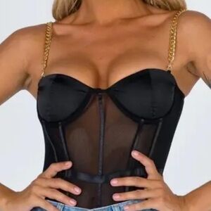 Black mesh body suit with gold chain straps